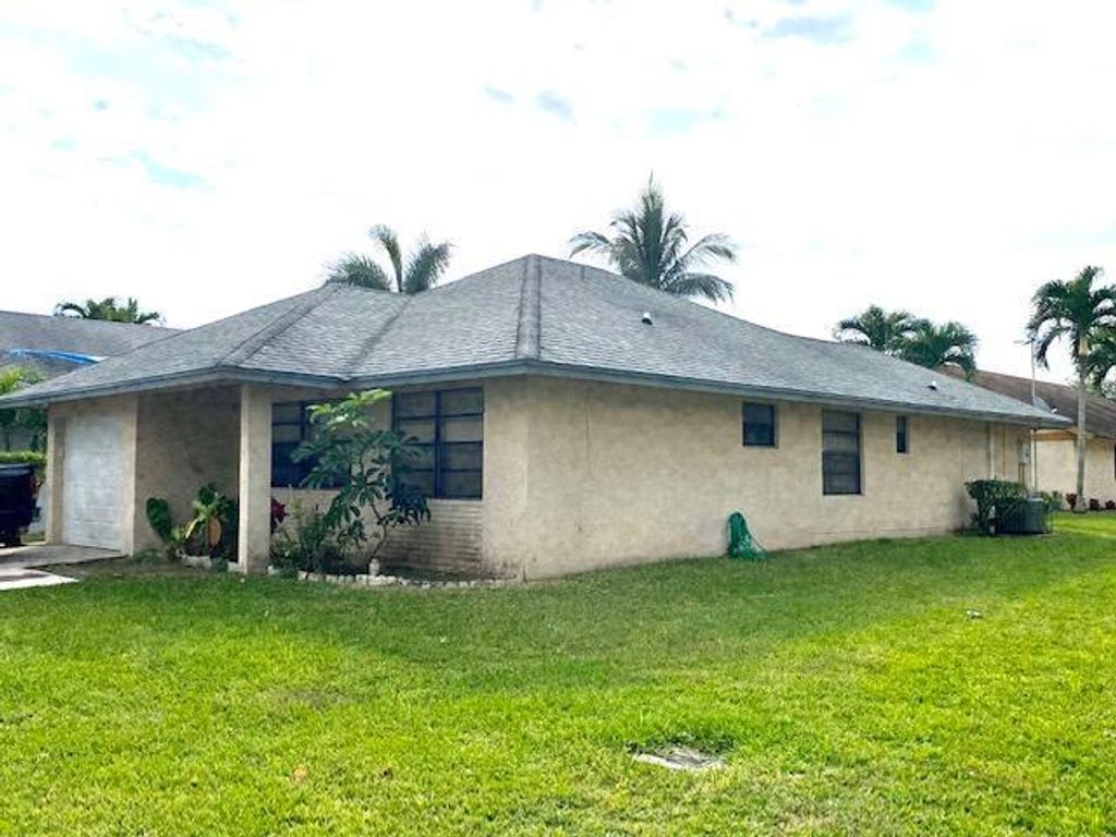 Photo of 1322 Pines Lane, West Palm Beach, FL 33415 (MLS # B26002935)