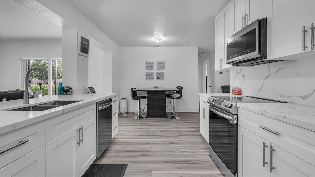 Photo of 4861 NW 6TH Court, Plantation, FL 33317 (MLS # B26075654)