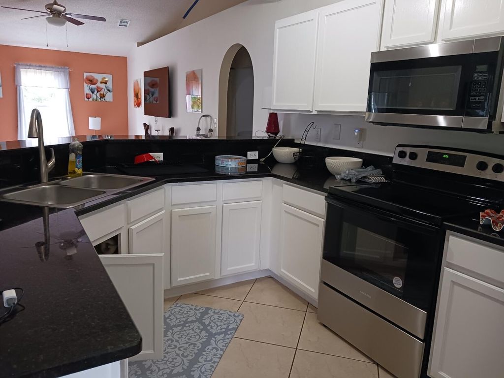Photo of 1282 SW Parma Avenue, Port Saint Lucie, FL 34953 (MLS # R10944725)