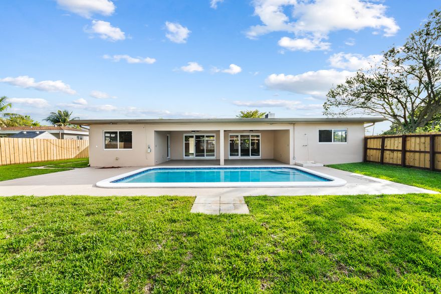 Architectural beauty. Mid-Century Modern 3-2-2 pool home in Melrose Park. 1682 sq ft under air. 2102 adjusted sq ft. 1/4 acre corner lot. Terrazzo floors, large covered front & rear porch, large laundry & utility room, newer washer/dryer, living/dining room area has 12ft vaulted ceiling w/stone wall, marble fire place & cove lighting. New kitchen cabinets/appliances, quartz countertop w/full backsplash & hi-hat lighting. Custom closets throughout. New electrical panel & switches. Impact windows/doors. 6-zone sprinklers, new fence, newly sodded backyard. Freshly painted interior & exterior. 5 new ceiling fans. New pool pump & sprinkler pump. Passed 4 point inspection Aug 2025. Silicone roof 2023 w/10 year warranty. Built in 1958 as "model home" by Marquesee Builders.