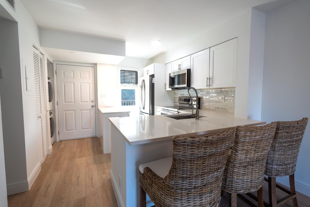 Photo of 2108 S Cypress Bend Drive #210, Pompano Beach, FL 33069 (MLS # R11140574)