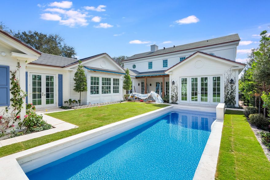 Welcome to this newly constructed 4 bedroom, 4.5 bathroom Colonial residence by Smith Kellogg Architecture, ideally situated in the coveted SoSo neighborhood. Offering 5,278 total sqft, the home features white oak wood floors throughout and a thoughtfully designed layout. The main level includes a spacious living room with a fireplace and a wet bar featuring a beverage fridge, wine fridge, and ice maker, plus a dedicated dining/family room and an expansive chef's kitchen outfitted with Thermador appliances along with a charming banquette breakfast nook. The main-floor primary suite offers a spa-inspired bath featuring dual vanities, a Roman tub, a private water closet, and a large walk-in closet. Upstairs, three additional bedrooms each feature en-suite baths, including a junior primary suite with dual vanities, a separate walk-in shower, Roman tub, and a generous walk-in closet. Outdoor living is equally impressive with a saltwater pool powered by Jandy equipment with iPhone control, complemented by a covered loggia and surrounded by a refined hardscape mix of Chicago brick and limestone. Additional highlights include an oversized 2-car garage and a whole house generator. Ideally located just 1.5 blocks from the Intracoastal and moments to everything West Palm Beach has to offer, including excellent dining, shopping, and entertainment.