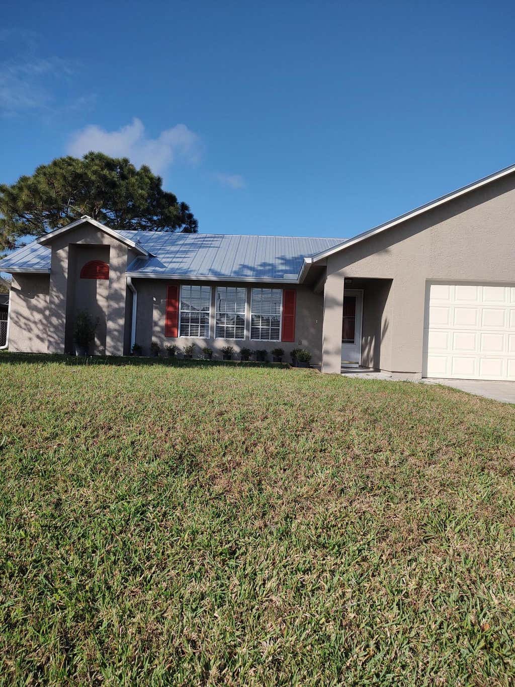 Photo of 343 SW Ridgecrest Drive, Port Saint Lucie, FL 34953 (MLS # R10782580)