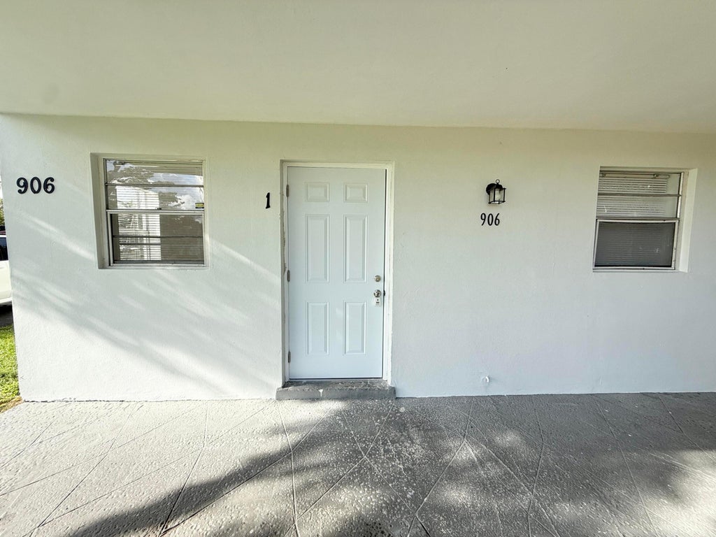Photo of 906 Foresteria Drive, Lake Park, FL 33403 (MLS # B26066747)