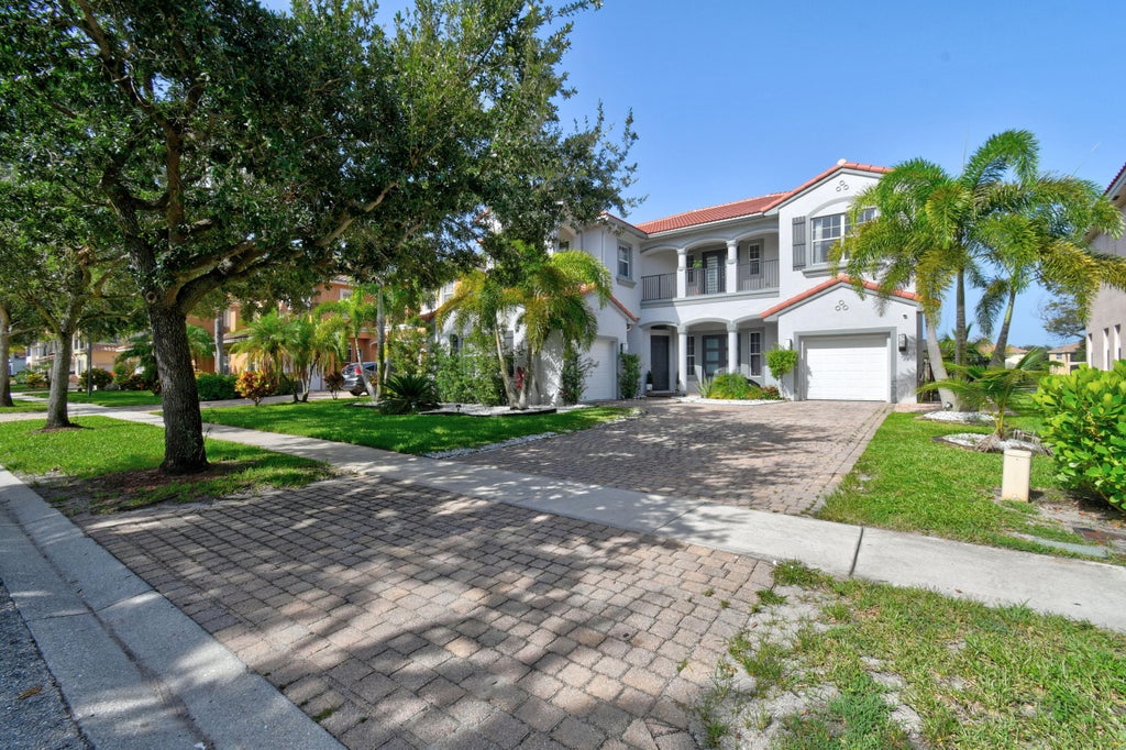 Photo of 700 Cresta Circle, West Palm Beach, FL 33413 (MLS # B26051288)