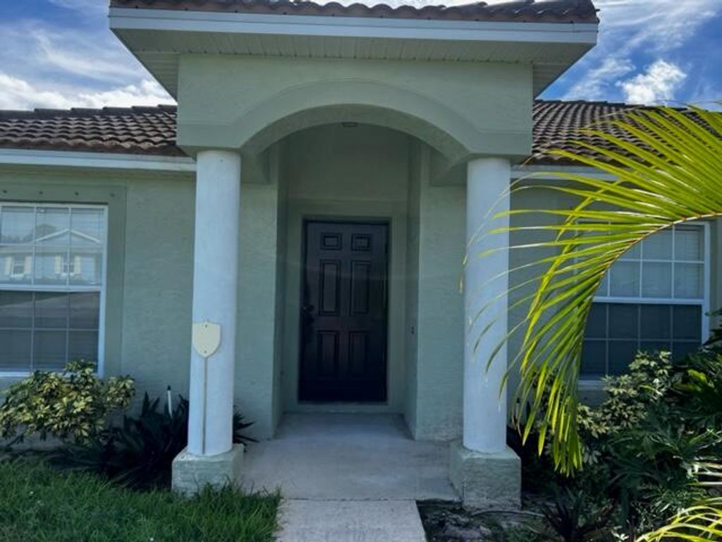 Photo of 1150 SW Hamrock Avenue, Port St Lucie, FL 34953 (MLS # R10929975)