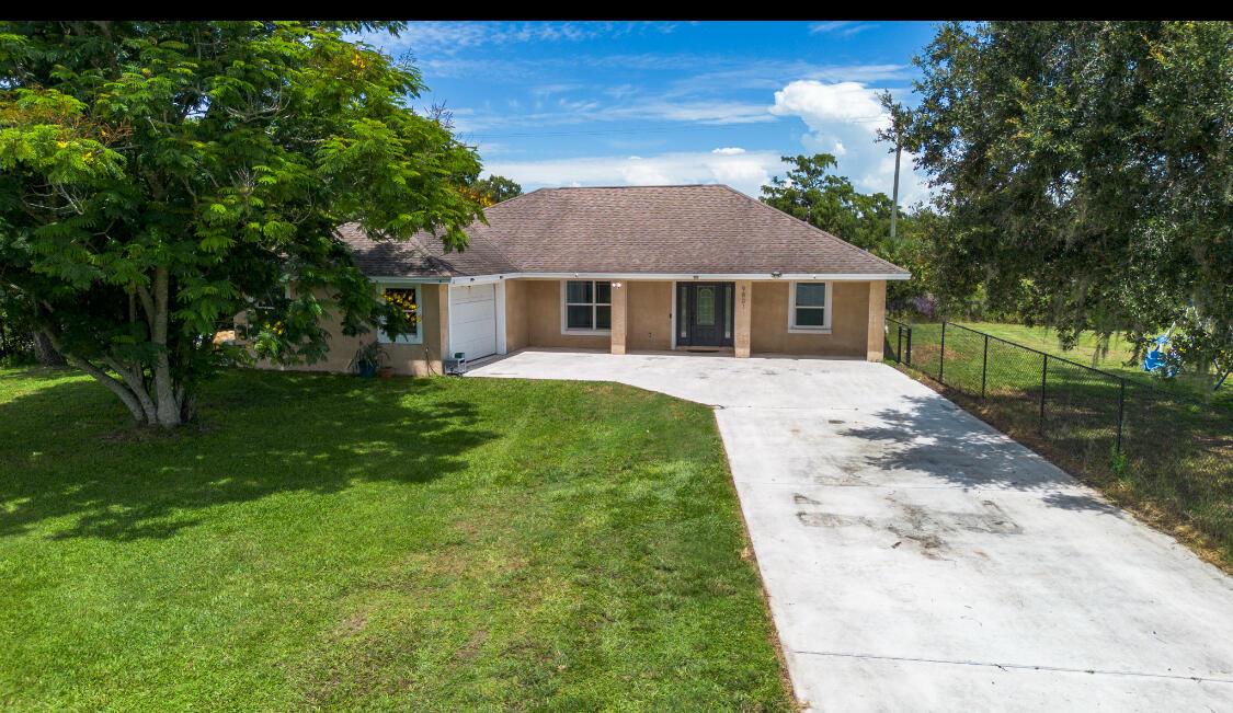 OAKS AT OKEECHOBEE- 3/2 CBS with garage on half an acre. Seller offering $10K towards buyers closing costs!!This beautifully maintained home features vaulted ceilings, modern kitchen with granite countertops, soft-close drawers, brand new stainless-steel gas appliances-including a stove with a built- in air fryer. Smart home upgrades including Alexa-controlled thermostat and lighting. The carpeted garage has its own A/C split unit-perfect for a gym or bonus room. Enjoy the screened in back porch, fenced side yard, reverse osmosis water system, and tankless water heater. Location is perfect for East Coast commuters. Low monthly utility costs thanks to gas appliances. Quiet and quaint neighborhood. Don't miss this move-in ready gem. Measurement's are approximate.