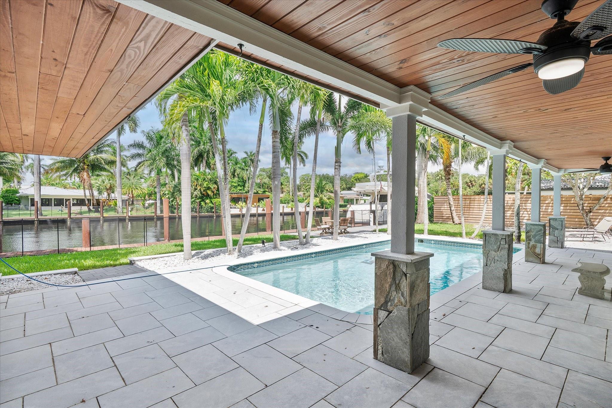 Beautifully renovated waterfront home in the highly coveted Riverland Woods Community. This modern stunner has a 100-foot dock on a deep water canal with no fixed bridges out to the ocean. It also sits on a 13,000 sq ft lot that's at the end of a cul-de-sac with NO HOA! The bright open floor plan features 4 bedrooms, 2 baths, designer closets, tiled floors, and a custom kitchen with top-of-the-line appliances. Note that it also has impact windows and doors, a 2-car garage, and a heated pool. Now is your time to join this boating community in Riverland. Here you'll be minutes to the beach, Las Olas, Dining, Entertainment, the Hardrock, & the Airport.