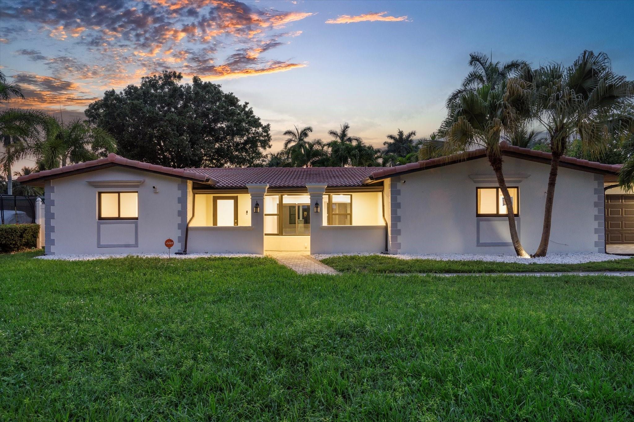 Beautifully renovated waterfront home in the highly coveted Lauderdale Isles. This modern stunner has a 100-foot dock on a deep water canal with no fixed bridges out to the ocean. It also sits on a 13,000 sq ft lot that's at the end of a cul-de-sac with NO HOA! The bright open floor plan features 4 bedrooms, 2 baths, designer closets, tiled floors, and a custom kitchen with top-of-the-line appliances. Note that it also has impact windows and doors, a 2-car garage, and a heated pool. Now is your time to join this boating community in Riverland. Here you'll be minutes to the beach, Las Olas, Dining, Entertainment, the Hardrock, & the Airport.