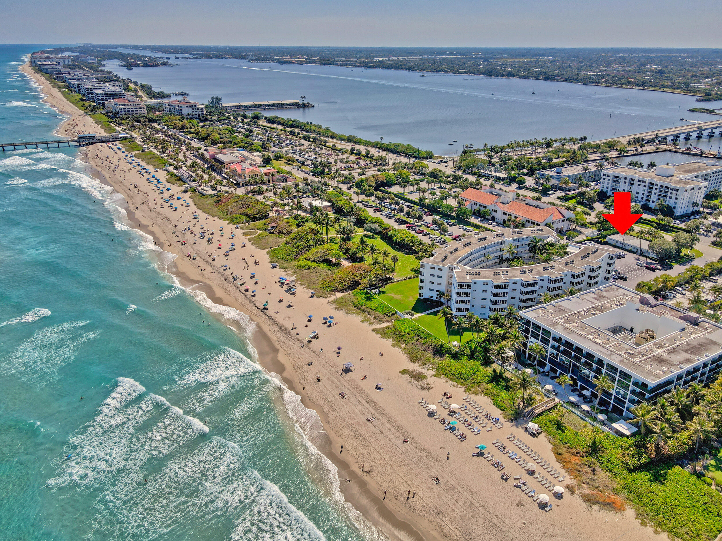 RESORT LIVING, OCEAN BUILDING, 9' high spacious ceilings, Turnkey ready, complete renovation! Owner removed and replaced interior walls, installed impact windows, new electricity, flooring, kitchen, bathroom, personal patio with lush greenery. This unit is very unique. The Palm Worth is known for their 6 story building, however, there is a smaller structure on the property in which this unit is located adjacent to the community room. This unit also comes equipped with state of the art fire sprinkler system, newly installed during the renovation. Fabulous second bonus room that could easily welcome short term guests or be used as a home office.