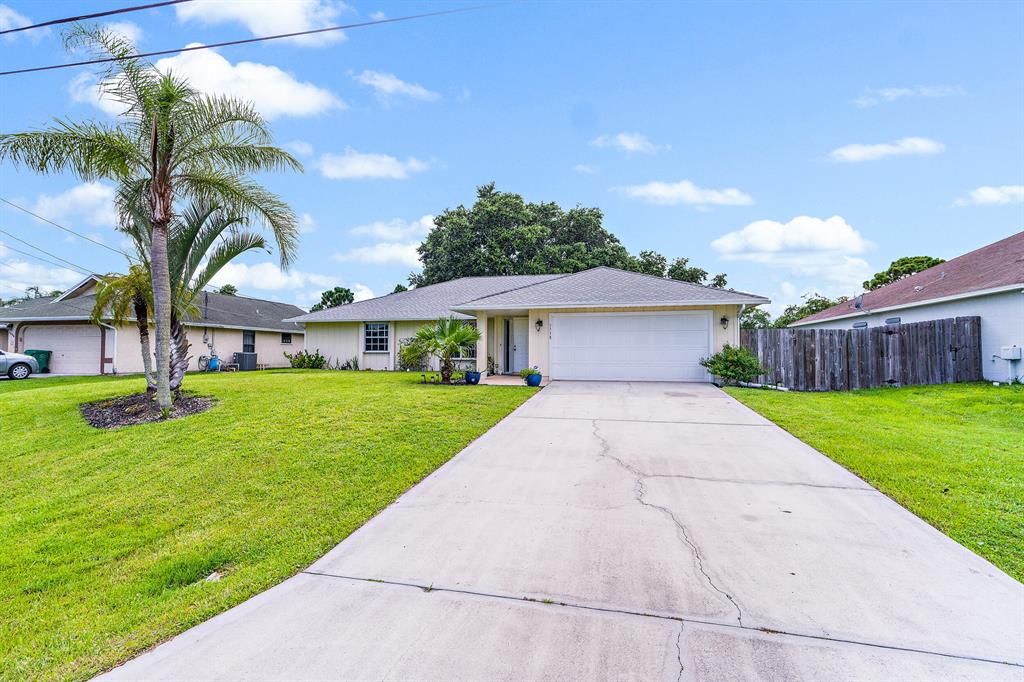 Photo of 3538 SW Pluto Street, Port Saint Lucie, FL 34953 (MLS # R10737531)