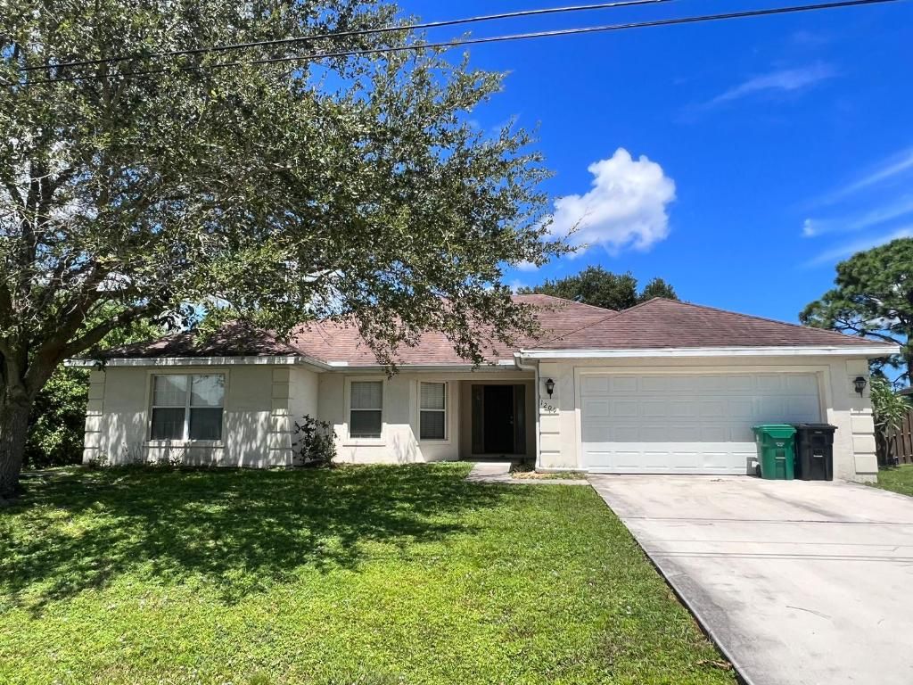 Photo of 1209 SW Idol Avenue, Port Saint Lucie, FL 34953 (MLS # R10917151)