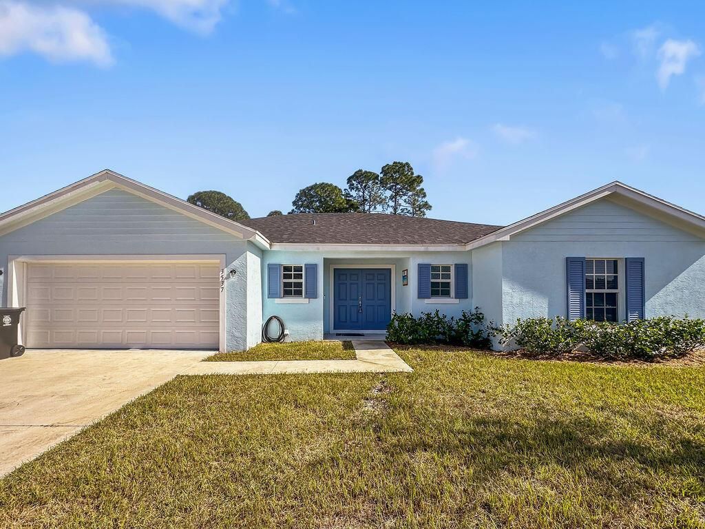 Photo of 3537 SW Vollmer Street, Port Saint Lucie, FL 34953 (MLS # R10963753)