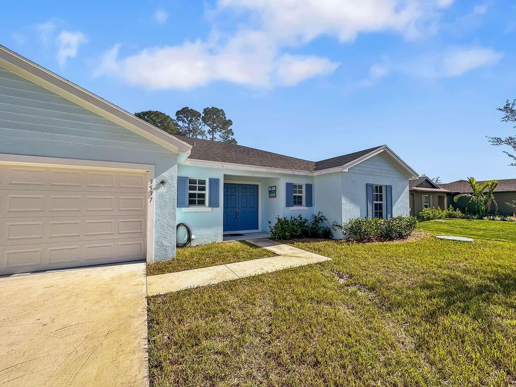 Photo of 3537 SW Vollmer Street, Port Saint Lucie, FL 34953 (MLS # R10963753)