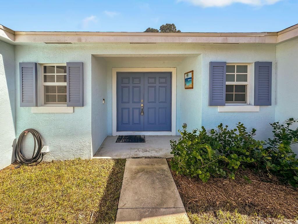 Photo of 3537 SW Vollmer Street, Port Saint Lucie, FL 34953 (MLS # R10963753)