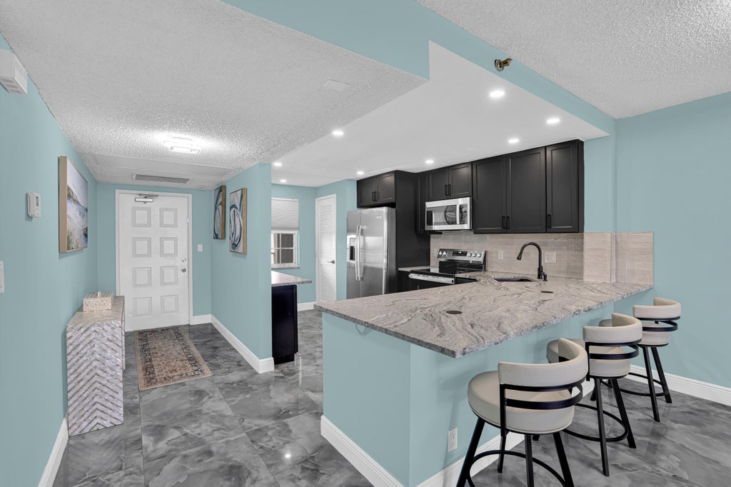 Photo of 4015 W PALM AIRE Drive #704, Pompano Beach, FL 33069 (MLS # B26060120)