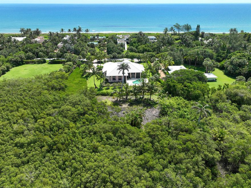 Walk to the beach from this private and tranquil 4 bedroom 4.5 bath house sitting on lush Jupiter Island. The separate primary bedroom features two large walk-in closets and access to the pool and expansive screened outdoor space which is perfect for relaxing or alfresco entertaining. Inside, the main rooms are connected and provide openness and light throughout. Three additional guest bedrooms each with their own en-suite baths offer complete privacy for guests and extended family. There is a 2 car plus 1 golfcart garage. Proximity to Bridge Rd allows for easy access on and off the Island.