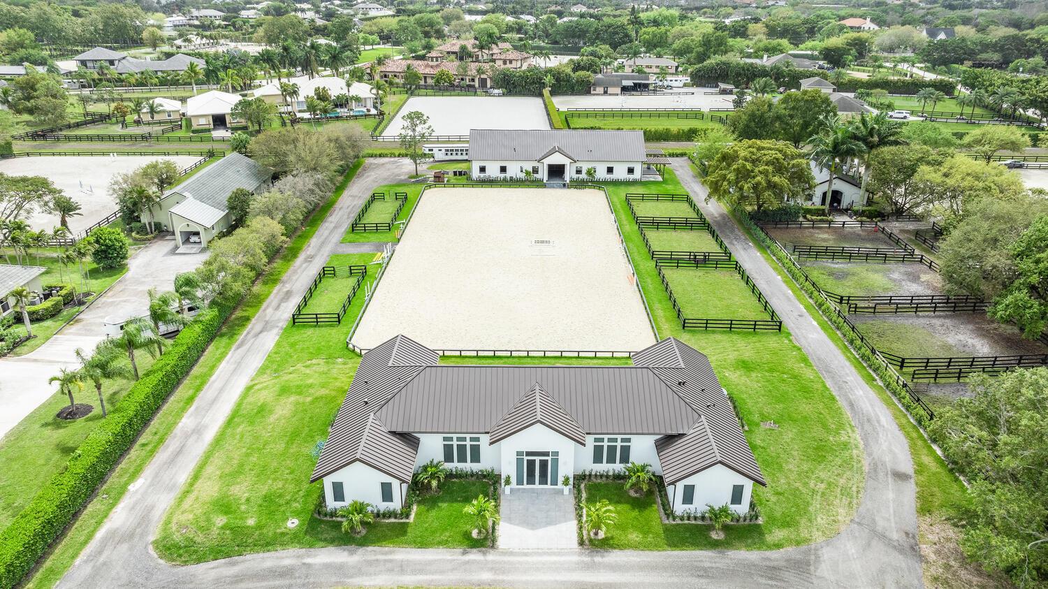 Furnished, Turn Key New Construction Estate located in the prestigious Saddle Trail community of Wellington. This meticulously designed property features a spacious 4-bedroom, 4-bathroom residence paired with a state-of-the-art 10-stall barn, offering the ultimate blend of comfort and functionality. Four generously sized bedrooms, each with its own en-suite bathroom. Thoughtfully curated interiors with high-end finishes, soaring ceilings, and an open-concept living space that seamlessly integrates with the outdoors. Gourmet Kitchen w/ premium appliances, custom cabinetry, and a large island perfect for entertaining. 10-Stall Barn: Designed for top-tier horse care, all weather GGT arena featuring spacious stalls, tack and feed rooms, wash racks, and a lounge