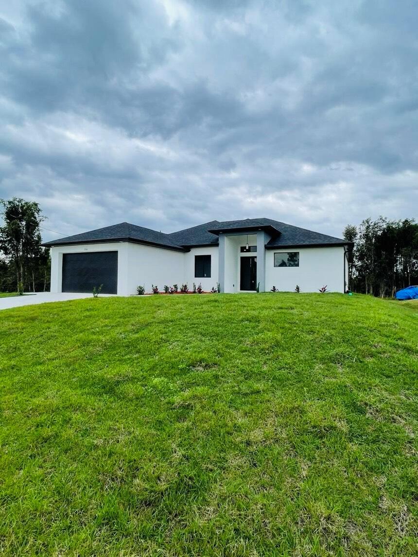 New house built in the year 2025.This property also meets the expectations of any demanding buyer, but it is also the family home of your dreams, every detail represents the warmth of a home and ensures a life of relaxation. Perfect for families of all sizes.Impact windows and doors, high ceilings and bright spaces, laundry inside, land available for construction of a pool.Situated in a prime location, close to shopping, restaurants and gorgeous beaches. This home truly hast it all!!