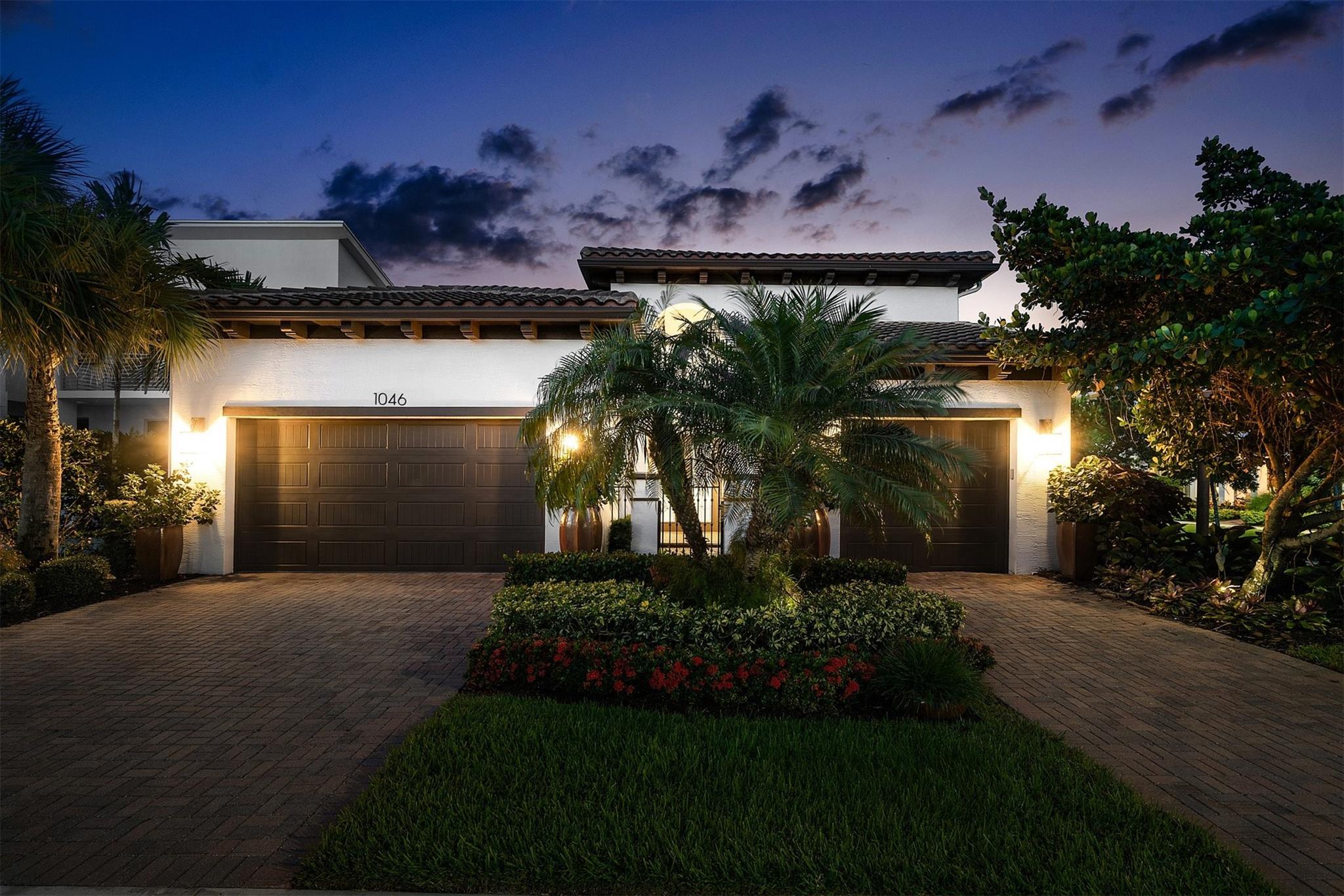 Welcome to 1046 Faulkner Terrace—where designer upgrades, high end furnishings create a unique and elevated Florida lifestyle
This former builder’s model stuns at every turn with over 2,800 sq ft of expertly curated interiors on a private preserve and corner lot. From the travertine-inlaid foyer with a beamed 19.5-foot ceiling, no detail was overlooked. The gourmet kitchen features a dramatic waterfall island, double-stacked KitchenCraft cabinetry with glass uppers and puck lighting, GE Profile appliances, and a pot filler over the 30" gas cooktop.