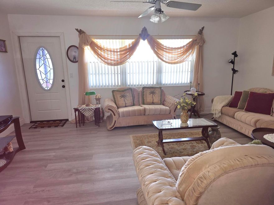 This corner condo with cool breeze evenings, features a 1 Bedroom, 1.5 bath with balcony. Floors were upgraded to vinyl and appliances are fairly new. Central A/C, Tankless water heater and  tiled floors. This prestigious gated community of Century Village, has 2 main entrances, which are manned security gates. Convenient buses that provide transportation to local shopping centers, restaurants, and medical facilities making getting around extremely manageable. The popular health club offers personal training and all the latest in exercise equipment. Feel free to join in traditional aerobics, Yoga, Pilates, and dance classes. The wave-walking (resistance) pool provides valuable low impact health benefits. Come and see yourself why living here is life changing and relaxing.