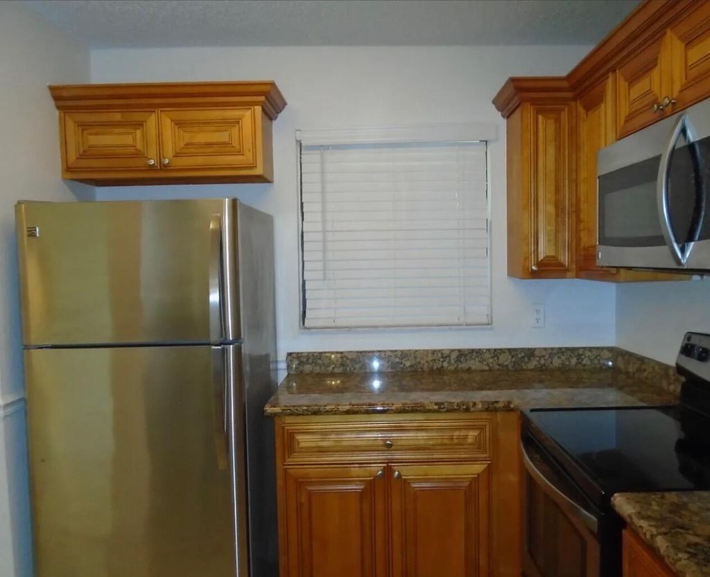 Photo of 1421 Windorah Way #H, West Palm Beach, FL 33411 (MLS # R11161604)