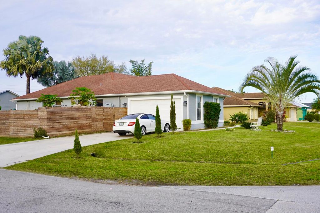 Photo of 1085 SW Liberty Avenue, Port Saint Lucie, FL 34953 (MLS # R10965088)