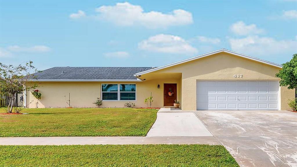 Stunning, split plan, freshly painted 4 bedroom, 2 bathroom house that is move in ready. Features crown molding throughout, solid wood kitchen cabinets with granite countertops, and stainless steel appliances which includes a Jenn-Air gas range. Hurricane impact windows and doors. Hardwood floor in master bedroom with large walk in closet and jetted tub. Enclosed patio, 2 car garage and pool with new diamond brite. Property is fenced with lushly landscaped backyard that has mature fruit trees. No HOA. A must see!! Sold As Is.