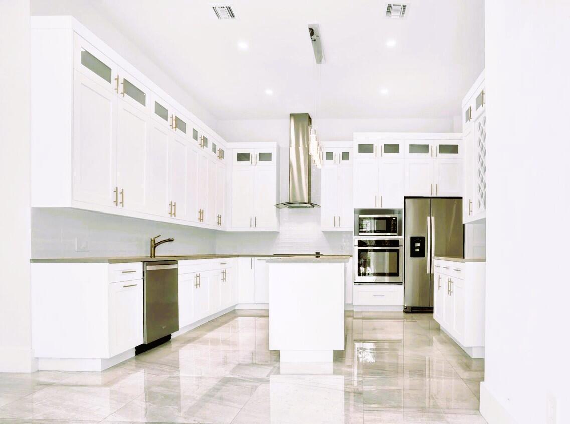 This corner unit townhome was built at the end of 2019, tall ceilings, with open layout kitchen design with high cabinets and high end stainless steel appliances, contemporary bathrooms with high quality cabinets, one of them with shower enclosure ADA compliance and the other one with high end quality bathtub. No HOA involved. Storage space in the attic. Annual Rentals Only. Impact doors and windows, wall and attic great insulation, tankless water heater make this townhome very energy efficient. One very spacious car garage with an electrical car charger and up to four cars parked on the double driveway. Less than 5 minutes to the beach and the famed Atlantic Ave with great restaurants and nightlife. UNFURNISHED