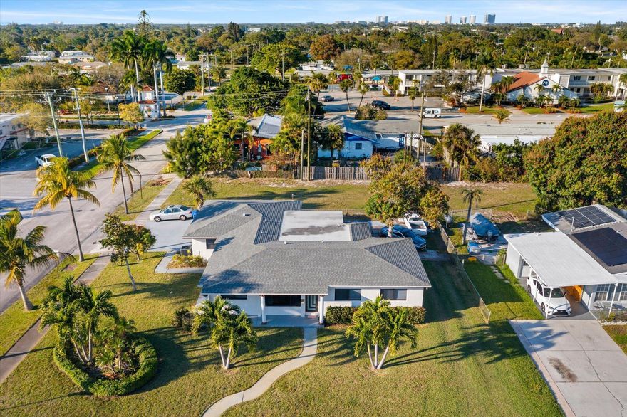 This Large 10,000 sq ft Corner Lot Home is Clean, Bright, Spacious and Located steps away from Downtown Lake Park, where there's Family entertainment,  Theatre, Eateries, Shopping and Waterside-Intercoastal Kelsey Park. 651 Foresteria is perfect for a Large Family or Wellness Facility offering 4 bed 3bath has a 2.5 car garage plus mini bonus space. Could covert to separate living quarters. Improvements: Roof 2023, AC 2025, Impact W&D 2025, Water Heater 2022, New Fans, Granite Counter Tops, Recess lighting and Chandeliers.
Exterior: Extended Paver Patio, Deep well water sprinkler system, multiple power sources in yard for outdoor decor plug ins, 1 avacado, 2 mango, 10 Palm trees, Sprinkler and Security camera.