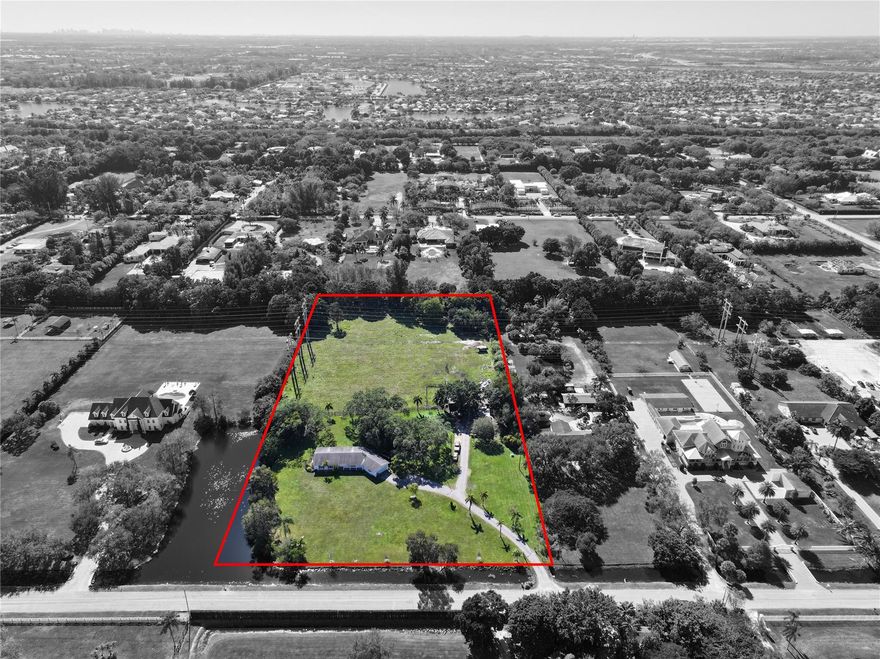 ***BEAULTIFUL PROPERTY IN SUNSHINE RANCHES NESTLED ON 4.70 ACRES!!!*** REMODEL INTO YOUR IDEAL RANCH HOME OR BUILD YOUR DREAM MANSION ON THIS LARGE PROPERTY. THIS HOME FEATURES A PEACEFUL LAKE AND LOTS OF SPAE TO BUILD BARN OR GUEST HOME.