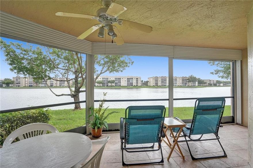 Unbelievable lake views from your very private screened in patio. Great sized unit in this 55+ community. 2 pools, Tennis and basketball courts, fantastic club room with entertainment and so many activities for residents. Courtesy bus service to take you around the area. This special unit has an additional fenced in area out front as well as a storage closet for your tools, bicycles and holiday decorations. Nice sized closets and storage.