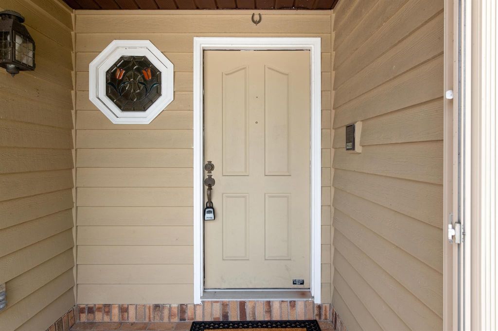 Photo of 785 SE Whitmore Drive, Port Saint Lucie, FL 34984 (MLS # R10991973)