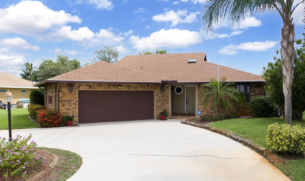 Photo of 785 SE Whitmore Drive, Port Saint Lucie, FL 34984 (MLS # R10991973)