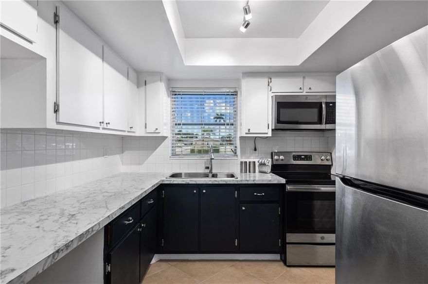 Fully renovated two bedroom one bath condo with water view.  Relax and enjoy South Florida's beautiful weather from your screen enclosed porch along with outside patio and lawn area, which is steps away from the water.  Beautiful wood grain porcelain tile flooring. New stainless steel appliances. New lighting fixtures and pocket doors throughout. AC 2018. Roof 2020. Accordion hurricane shutters. Furniture negotiable. No assessments! Dudley Villas West is a 55+ community featuring amenities of a Clubhouse, pool, sauna, Exercise room. The Association requires a minimum credit score of 693 along with a minimum annual income of $30K yearly income and 30% down payment.
