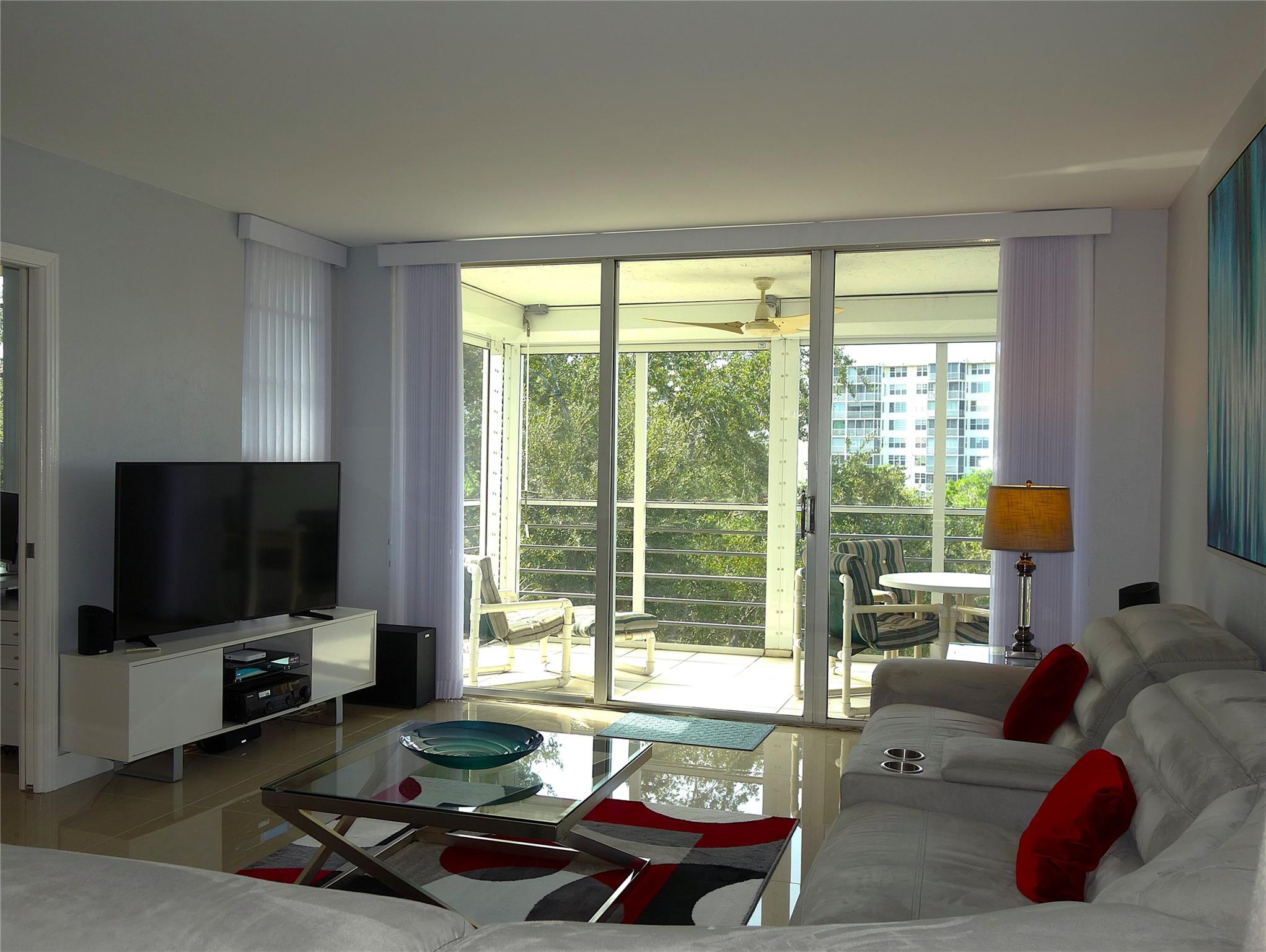 Beautifully updated top-floor 2/2 condo on Palm Aire’s Oaks Lane has style, comfort and outstanding views. Featuring elegant 24x24 porcelain tile, all impact windows, electric hurricane shutters that enclose the screened balcony, High-end appliances, premium draperies, and custom blinds that add a touch of luxury. Located in Palm Aire Country Club Section 5—just steps from miles of scenic walking and biking paths—this well-managed community is known for its strong financials and structural integrity. Amenities include a heated pool, clubhouse, shuffleboard, grilles and sauna all conveniently located just across the street. ( Note: Sliding door vertical blinds/sheers are pure white).
The condo fee includes water, sewer, trash, cable, and internet, offering excellent value and convenience.