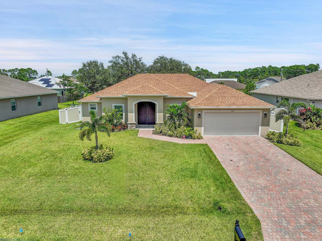 Photo of 1561 SW Mullinax Avenue, Port Saint Lucie, FL 34953 (MLS # R11014295)