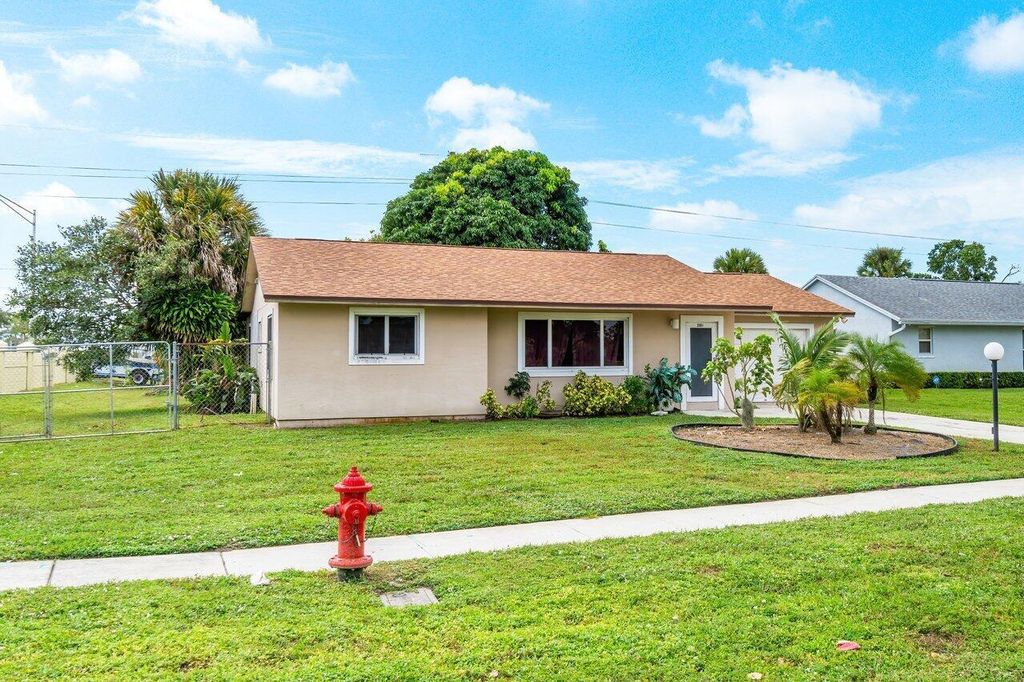 Photo of 2501 Canterbury Drive S, Riviera Beach, FL 33407 (MLS # R10930783)