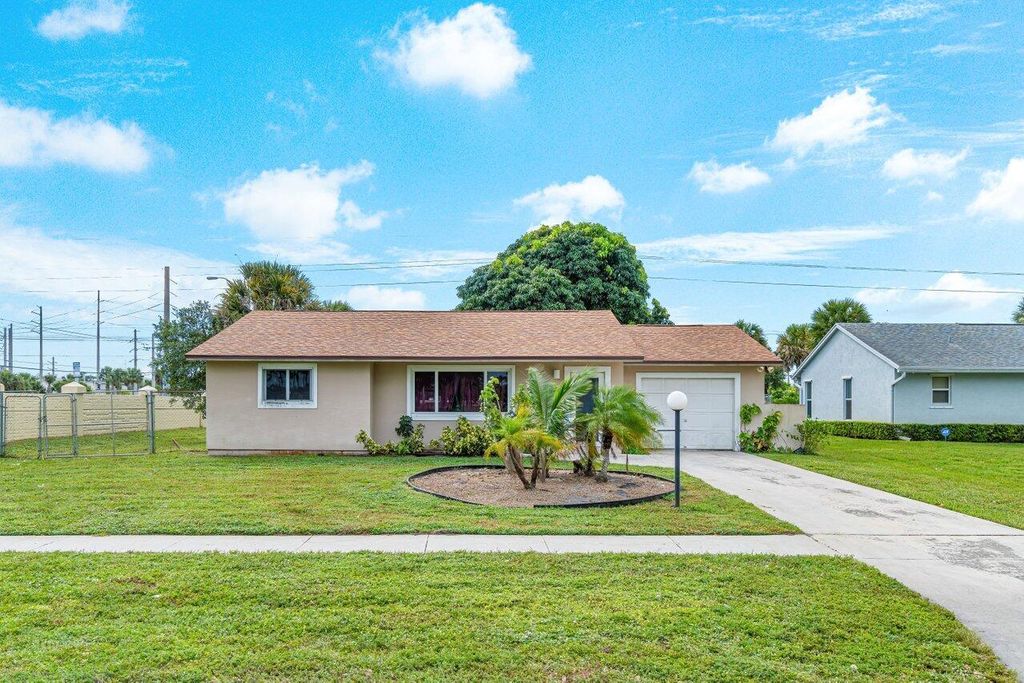 Photo of 2501 Canterbury Drive S, Riviera Beach, FL 33407 (MLS # R10930783)