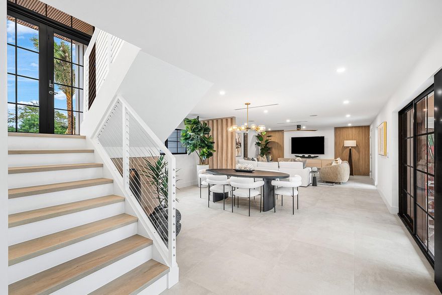 Welcome to 478 NW 13th St, a completely rebuilt 4B/ 4.5B home in the heart of Boca Raton offering spacious living w/high-end finishes throughout. The 4th Bedroom is a flex room w/ensuite on the main level. Italian porcelain floors, custom closets, and bright, open rooms. The outdoor area is ideal for entertaining, featuring a new pool with a sun-shelf, marble pavers, a summer kitchen, and is beautifully landscaped with lighting and irrigation. All new electrical, plumbing, and mechanical systems,  with energy-efficient materials for comfort and sound control. Smart features include lighting, security, built-in speakers, hardwired internet, and a smart primary bathroom. A two-car garage with an electric vehicle charger completes this move-in-ready home. Schedule your private showing today!