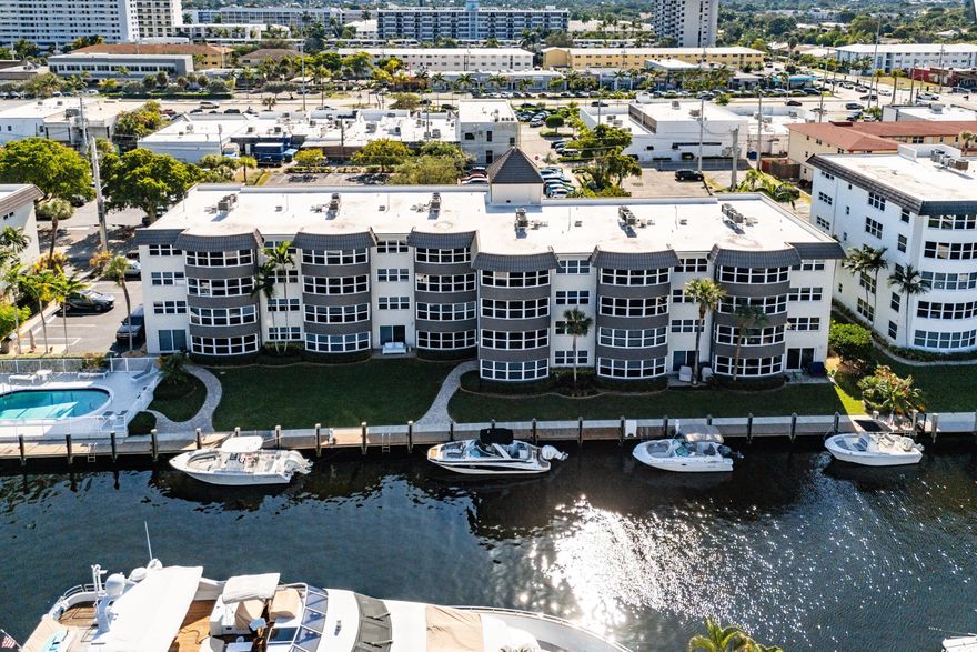 Best location in Heritage Landings! This 1st floor condo offers direct water views and unbeatable convenience just steps from the heated pool. With a boat dock available and no fixed bridges, it's the perfect beach and boater's dream in the heart of Lauderdale-by-the-Sea. This beautifully pet friendly updated 2 bed 2 bath unit features a desirable split floor plan, an open layout, and abundant natural light. The upgraded kitchen includes recessed lighting, a kitchen island with quartz countertops, ample storage, and an in-unit washer & dryer. Enjoy tile flooring throughout for durability and easy maintenance. The spacious primary bedroom offers gorgeous water views and a large walkin closet, while the ensuite bath features glass shower doors and classic finishes. Heritage Landings provides outstanding amenities including a heated pool, BBQ area, tiki hut, and dog park. Boaters will love the easy canal access, and beachgoers will appreciate being just a short walk to the LBTS beaches, shops, restaurants, nightlife, and more. The property is also minutes from the Pompano Beach Pier and Fort Lauderdale beachfront promenade, known for excellent dining, shopping, and entertainment.  Investors welcomed annual rentals are allowed immediately after closing. With all certifications and SIRS completed, assessments fully paid, and major improvements such as new elevators, dock, pool, and AC water towers, this residence offers a truly turnkey and stress-free ownership experience.