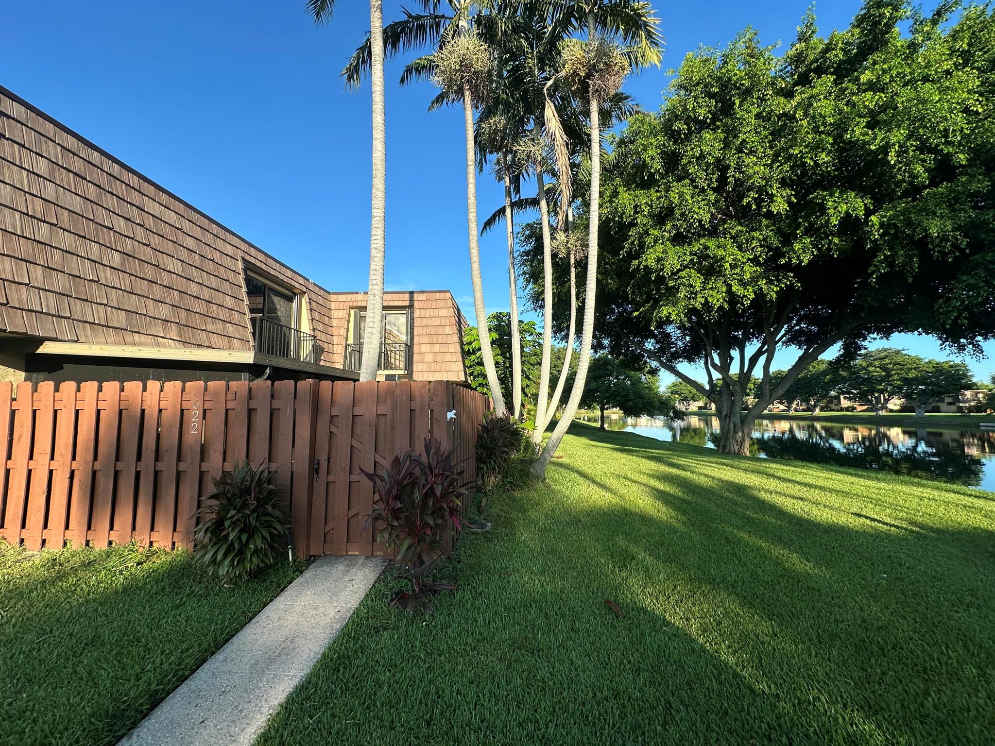 Beautiful lake view, 3 bedroom 2.5 bath Townhouse located in the well maintained community of Springdale in the Village of Palm Springs. This unit offers spacious living space, a covered screened in patio 2 private parking spaces. The Master Bedroom & guest room on the 2nd floor, have a balcony so that you can sit and enjoy the lake view. The association offers a Clubhouse complete with a gym, pool, Tennis & Pickleball Courts. Springdale is located close to I95 and the Turnpike. This is a MUST see, this Gem won't last long!