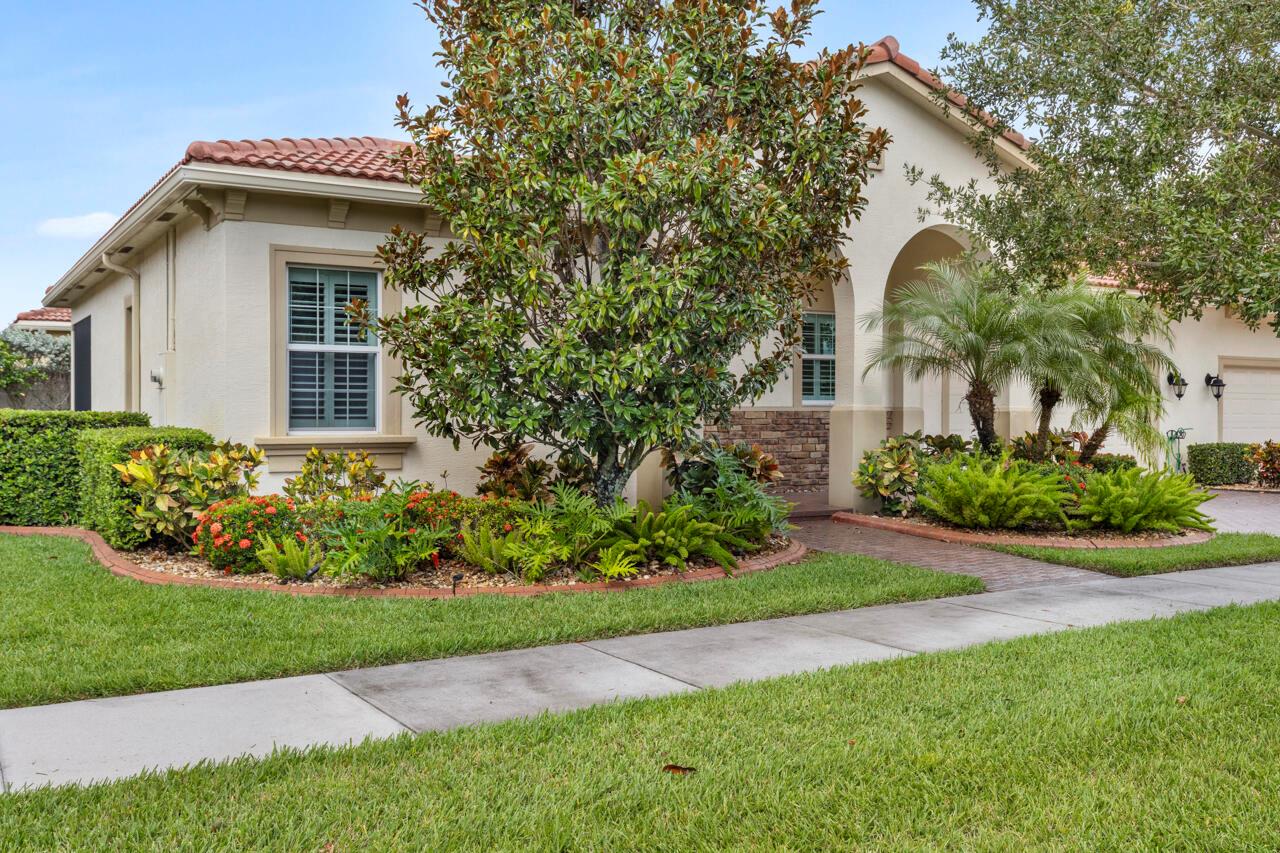 Experience luxury living in the prestigious PGA Verano community in St. Lucie West. This stunning 2-bedroom, 2-bathroom home with a 2-car garage features high ceilings with crown molding, impact windows, plantation shutters, and tiled floors throughout. The open-concept living space includes a gourmet kitchen with beautiful cabinetry, granite countertops, stainless steel appliances, and a pantry. The spacious master suite offers patio access, a walk-in closet, dual vanities, and a soaking tub. Relax or entertain on the screened patio with a stylish paver deck.