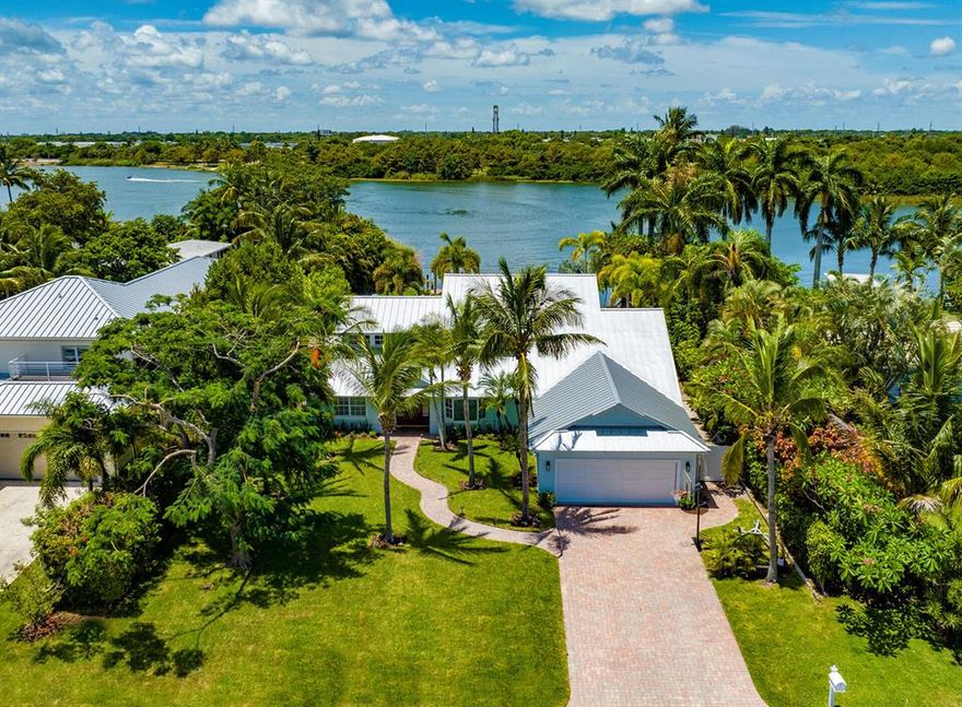 A great property for relaxation, lounging, and fun in the sun, with a heated pool and patio set within a large tropically landscaped grass-carpeted back yard, residents enjoy the best of outdoor living, along with great sunset views and opportunities for water play. With 85± feet of lakefront, its floating dock can accommodate WaveRunners or a small boat.  The information herein is deemed reliable and subject to errors, omissions or changes without notice.  The information has been derived from architectural plans or county records. Buyer should verify all measurements. LOCATION: 

1440 Lake Drive, Delray Beach, Florida: Minutes from the beach and vibrant downtown Delray Beach, the desirable Lake Ida neighborhood is a peaceful oasis centered on a picturesque lake offering boating, fishing, and access to South Florida's chain of lakes.  There are two lakefront parks, one home to the Delray Beach Playhouse.

PROPERTY: 
 
A great property for relaxation, lounging, and fun in the sun, with a heated pool and patio set within a large tropically landscaped grass-carpeted back yard, residents enjoy the best of outdoor living, along with great sunset views and opportunities for water play. With 85 feet of lakefront, its floating dock can accommodate WaveRunners or a small boat.

RESIDENCE:  

An exceptional opportunity to lay claim to a very special tropical paradise, this chic residence offers a stunning South Florida architectural style on a beautifully landscaped lakefront parcel of land, as well as environmentally friendly amenities. A captivating combination sure to please, with a decidedly Florida-Contemporary flair and easy-going as well as elegant ambience, this four-bedroom residence, with 4847 +/- total square feet, is organized around an open-floorplan that optimizes sunset lake views from every major room.  Creatively reimagined with a three-year renovation just completed, details include a new metal roof, wide-planked wood flooring throughout, first-floor automatic shades, new laundry room and a brilliant split-bedroom layout that places the primary suite presiding over the entire second floor. Environmentally friendly amenities include a solar system that eliminates a monthly electric bill, a Tesla Power Wall providing backup power to the house, full-house water treatment system and impact windows and doors throughout. One large, light, bright space with walls of glass windows and doors, the living area, featuring a natural-burning fireplace and peaked ceiling, the dining area, and family room flow fluidly around a wonderful gourmet kitchen, which is positioned perfectly for easy family living and gracious entertaining. Centered around a huge island with pull-up seating for six, the kitchen is at the residence's very heart, fitted with custom wood cabinets, granite counters, and professional-grade appliances. Also on the first floor are three guest-bedroom suites, and offering a more contemplative space, the library/office, which also offers views of the lake and pool, is just off the main living area. Presiding over the entire second floor, the primary suite, a private haven, is arranged around a huge bedroom with a sitting area, crowned by a peaked ceiling and opening to a large balcony overlooking the pool and the lake. The suite also comprises a huge custom-fitted walk-in closet and a deluxe ensuite tiled bathroom with dual sinks, bidet, walk-in shower and soaking tub. Completing the layout are a half-bath, laundry and an attached two-car garage.

DISCLAIMER: Information published or otherwise provided by the listing company and its representatives including but not limited to prices, measurements, square footages, lot sizes, calculations, statistics, and videos are deemed reliable but are not guaranteed and are subject to errors, omissions or changes without notice. All such information should be independently verified by any prospective purchaser or seller. Parties should perform their own due diligence to verify such information prior to a sale or listing. Listing company expressly disclaims any warranty or representation regarding such information. Prices published are either list price, sold price, and/or last asking price. The listing company participates in the Multiple Listing Service and IDX. The properties published as listed and sold are not necessarily exclusive to listing company and may be listed or have sold with other members of the Multiple Listing Service. Transactions where listing company represented both buyers and sellers are calculated as two sales. The listing company's marketplace is all of the following: Vero Beach, Town of Orchid, Indian River Shores, Town of Palm Beach, West Palm Beach, Manalapan Beach, Point Manalapan, Hypoluxo Island, Ocean Ridge, Gulf Stream, Delray Beach, Highland Beach, Boca Raton, East Deerfield Beach, Hillsboro Beach, Hillsboro Shores, East Pompano Beach, Lighthouse Point, Sea Ranch Lakes and Fort Lauderdale. Cooperating brokers are advised that in the event of a Buyer default, no financial compensation will be paid to a cooperating Broker on the Deposits retained by the Seller. No financial compensation will be paid to any cooperating broker until title passes or upon actual commencement of a lease. Some affiliations may not be applicable to certain geographic areas. If your property is currently listed with another broker, please disregard any solicitation for services. Copyright 2022 by the listing company. All Rights Reserved.