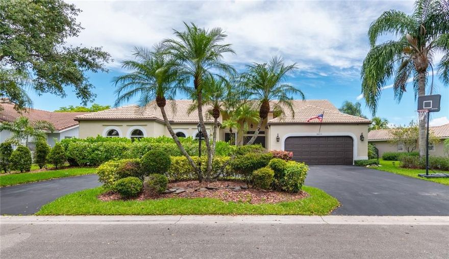 Stunning Waterfront 4 Bedroom 2 1/2 Bathroom Pool Home with a Split Floor Plan.  Completely Updated with a Huge Kitchen to Include Black Stainless Steel Appliances, Double Oven and Quartzite Counter-Tops. Wood Floors Throughout the Home and Vaulted Ceilings.  Bathrooms have been Updated with Vanity's and Counter Tops.  Master Bathroom has Separate His and Hers Master Vanity's and Closets, Artificial Turn Fenced in Backyard with a Pool Overlooking a Serene Canal View, an Entertainers Delight.  Gated Neighborhood. Dining, Shopping and Entertainment is Located very Close By.  Sawgrass Expressway with Easy Access to the Turnpike.