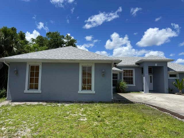 Photo of 1319 SW Granville Avenue, Port Saint Lucie, FL 34953 (MLS # B26037847)