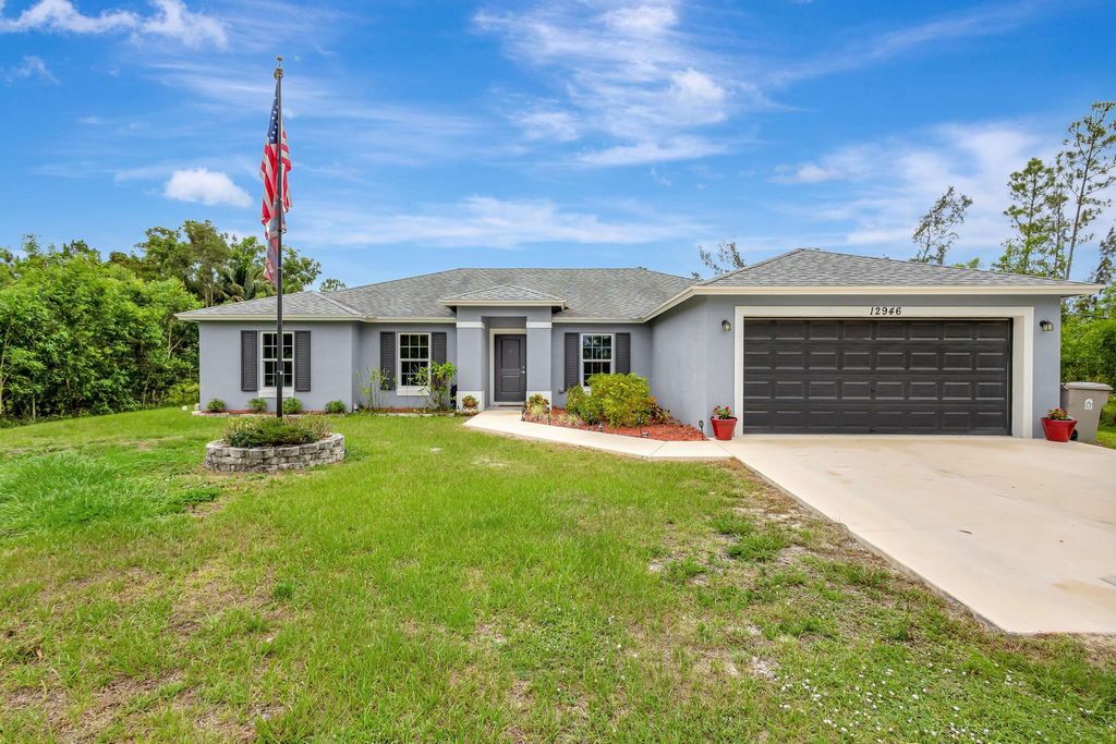 Photo of 12946 63rd Lane N, The Acreage, FL 33412 (MLS # R11096464)
