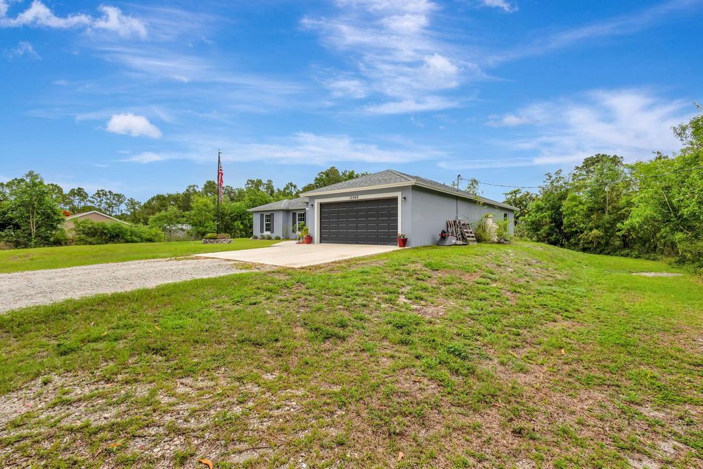 Photo of 12946 63rd Lane N, The Acreage, FL 33412 (MLS # R11096464)