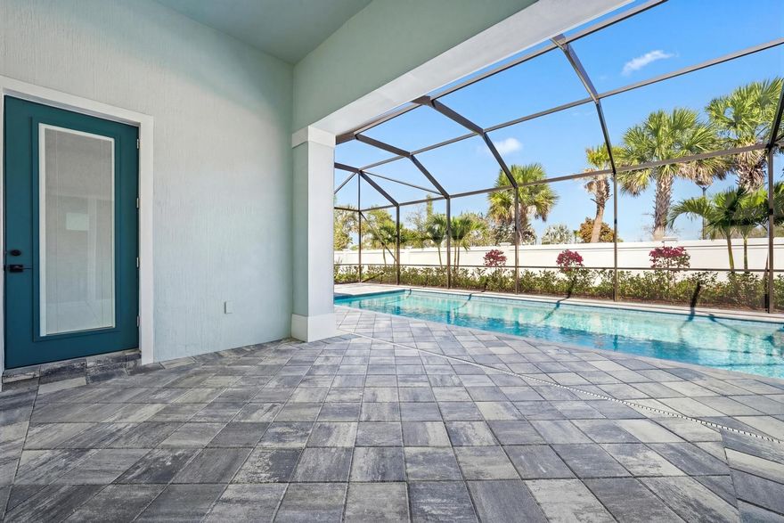 Set within the sought-after Avondale neighborhood of Avenir in Palm Beach Gardens, this exceptional Stellar model from the Estate Collection blends modern design, thoughtful upgrades, and effortless indoor-outdoor living. Offering 3 bedrooms, 4 full baths, and 2,523 square feet, this beautifully enhanced residence is positioned on a .23-acre estate lot with a desirable coastal exterior and a true three-car garage featuring a rare 4-foot extension. From the moment you enter, the home's light-filled layout and refined finishes make an immediate impression. A dramatic zero-corner sliding glass door in the gathering room creates seamless connectivity to the lanai, blurring the lines between interior and exterior living. Luxury vinyl plank flooring flows throughout all living areas, complemented by upgraded LED lighting and a curated four-light downlight package in the gathering room and owner's suite.
The kitchen is both elevated and functional, showcasing upgraded cabinetry, 1.2" quartz countertops, pendant pre-wiring, and a layout designed for gathering. Technology and convenience are thoughtfully integrated with a Smart Home low-voltage package, wireless access points, a 16-port network switch, flat-panel TV prep with LAN wiring in all bedrooms and gathering areas, and custom TV mounts.
Each bath has been tastefully enhanced. The owner's suite features a spa-inspired bath with a walk-in shower and soaking tub, heavy frameless glass enclosure, dual shower heads, upgraded countertops, fixtures, and custom mirrors. Secondary baths also offer walk-in showers with frameless glass, upgraded finishes, and custom detailing. A dedicated lanai bath with walk-in shower adds convenience for poolside entertaining.

Step outside to your private retreat--highlighted by a 14' x 30' custom pool with screen enclosure, gas line stub-out at the lanai, and generous covered space designed for year-round enjoyment. The backyard setting provides both privacy and the perfect backdrop for relaxed Florida living.

Additional upgrades include an advanced HVAC air quality system with Carbon Clean MERV 16 filter, UVA light, and catalyst, a full laundry room with upgraded cabinetry and sink, a complete security system with three wired outdoor cameras and integrated video doorbell, and a meticulously finished garage with custom epoxy flooring, additional lighting, keyless entry, GFI circuit, sink, and LED enhancements.

Avondale at Avenir offers a vibrant, amenity-rich lifestyle with resort-style pools, fitness facilities, walking trails, and the future Town Center bringing dining and shopping moments away. Surrounded by preserved green space yet close to everything Palm Beach Gardens has to offer, this residence represents refined, move-in-ready living in one of South Florida's most dynamic new communities.