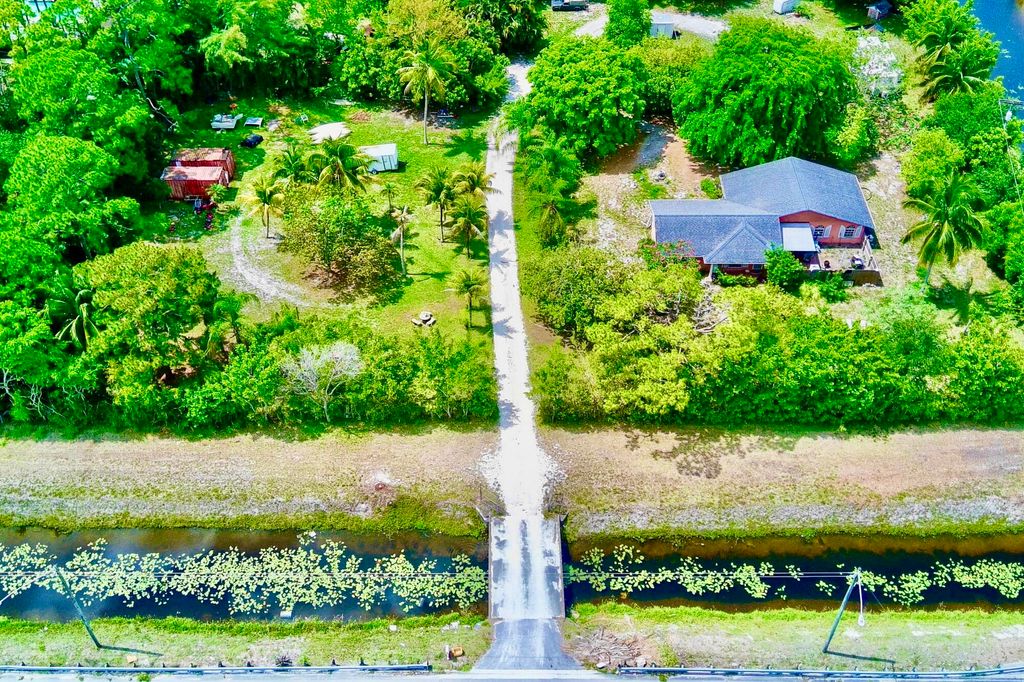 Photo of 5947 Hypoluxo Road, Lake Worth, FL 33463 (MLS # B26004963)